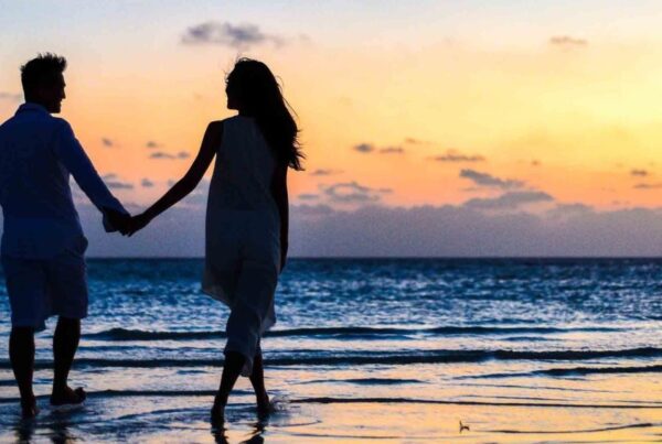 A beautiful couple holding hands at a beach